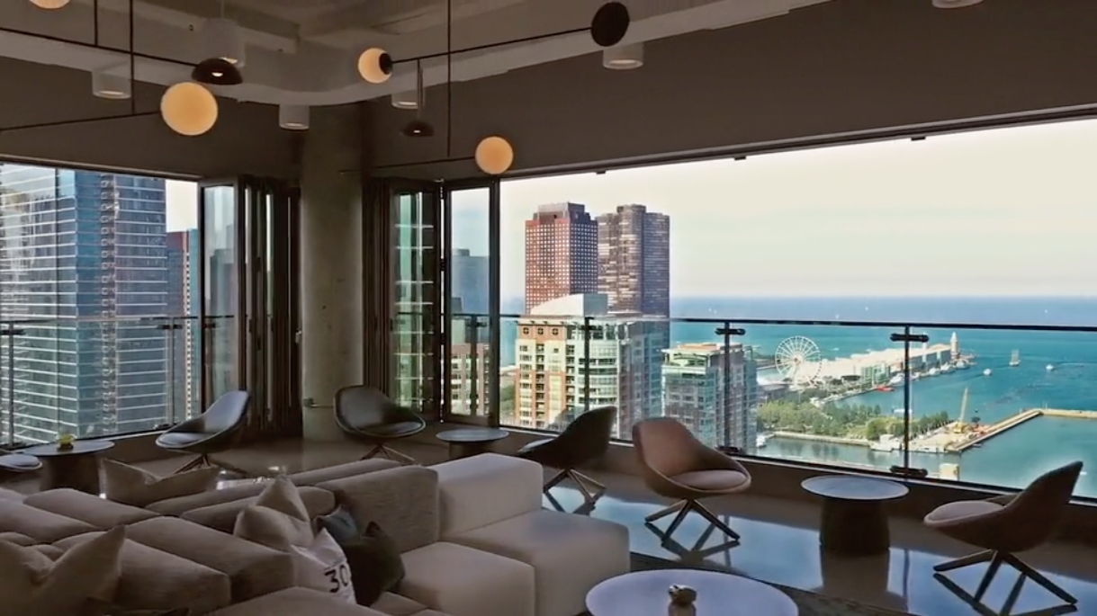 The Lighthouse @ 303 Rooftop Lounge — 30th floor lounge with floor-to-ceiling windows overlooking the Chicago skyline and Lake Michigan